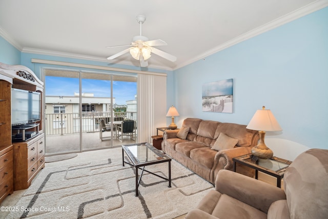 living room featuring ceiling fan and ornamental molding