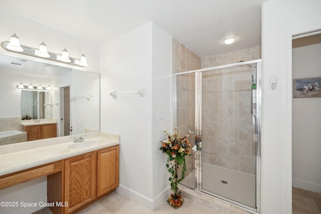 bathroom featuring tile patterned floors, walk in shower, and vanity