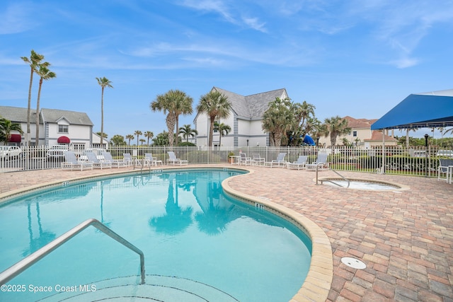 view of swimming pool with a patio