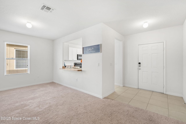 entrance foyer with light carpet