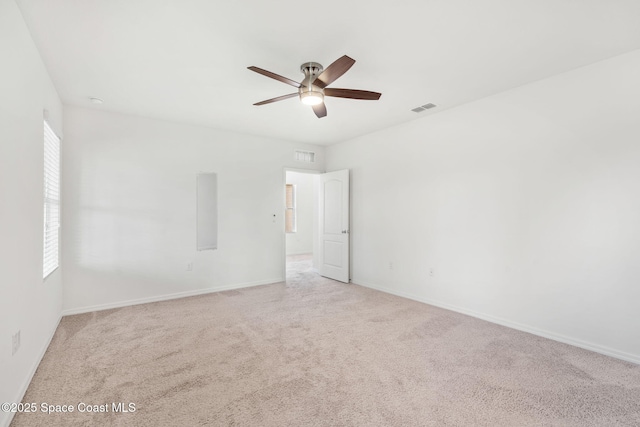 carpeted empty room featuring ceiling fan