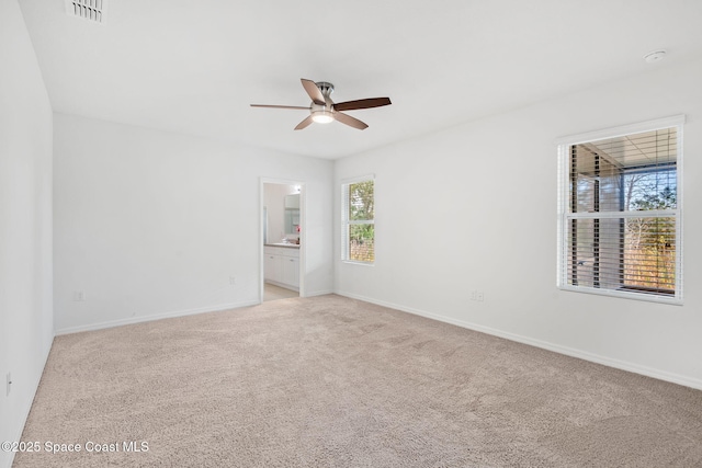 carpeted empty room with ceiling fan