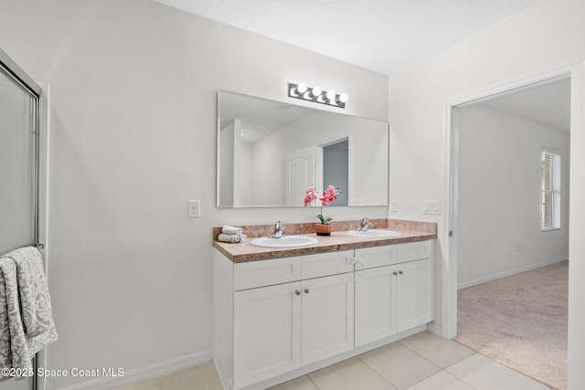 bathroom with vanity and tile patterned flooring