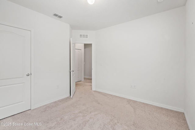 unfurnished bedroom featuring light colored carpet