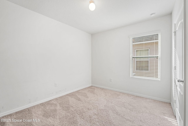 spare room with carpet floors