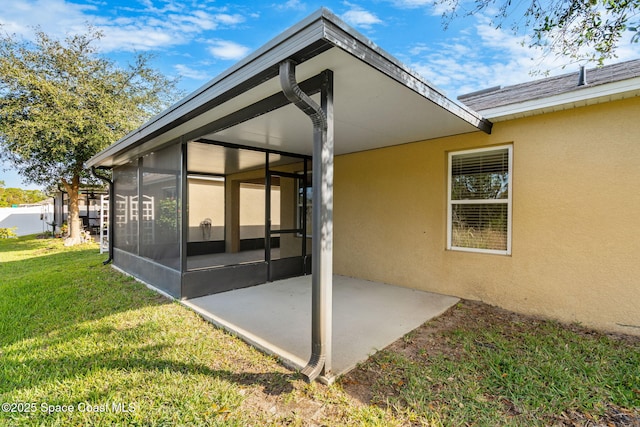 exterior space featuring a lawn and a patio