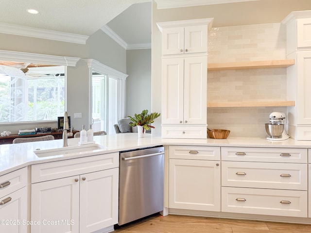 kitchen with white cabinetry, dishwasher, sink, backsplash, and crown molding