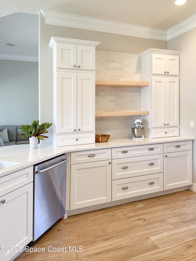 kitchen with dishwasher, white cabinets, decorative backsplash, ornamental molding, and light hardwood / wood-style flooring