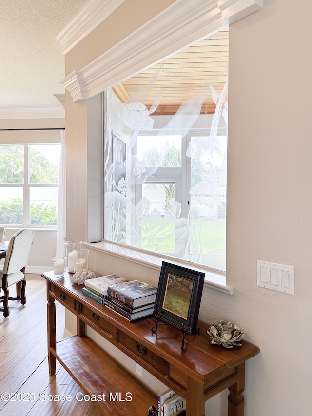 office area featuring hardwood / wood-style flooring and ornamental molding