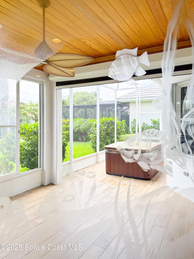 sunroom / solarium featuring wooden ceiling