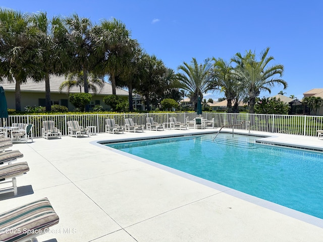 view of swimming pool with a patio