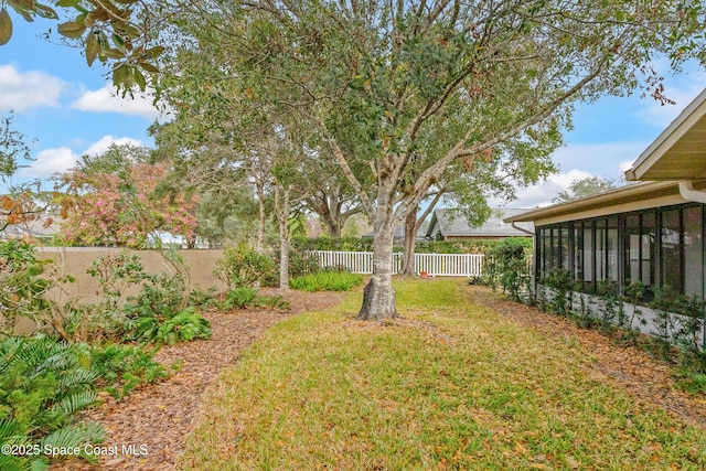 view of yard with a sunroom