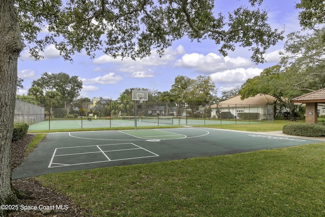 view of basketball court with a lawn