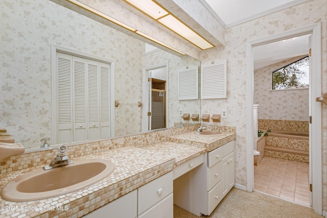 bathroom featuring a tub to relax in, tile patterned flooring, vanity, ornamental molding, and toilet