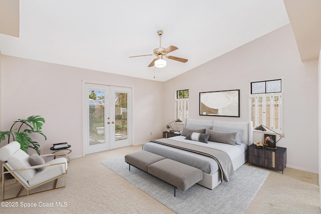 carpeted bedroom with access to exterior, vaulted ceiling, french doors, and ceiling fan