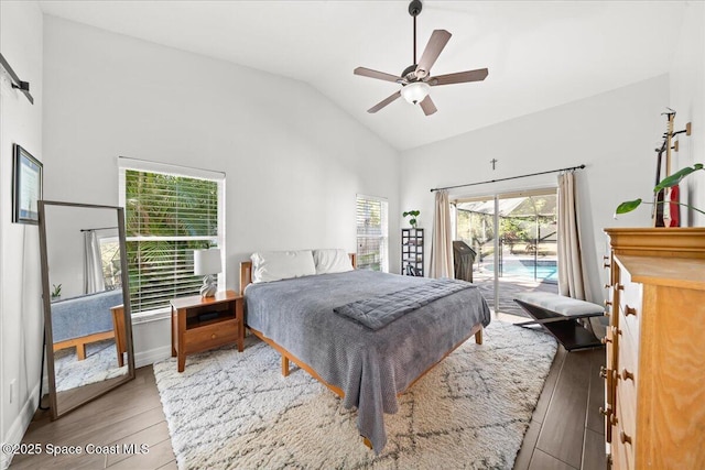 bedroom featuring access to outside, multiple windows, ceiling fan, and wood-type flooring