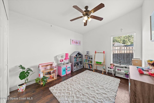 rec room featuring lofted ceiling, ceiling fan, and dark hardwood / wood-style floors