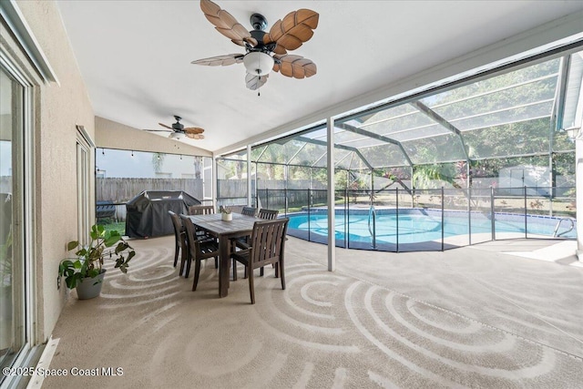 view of swimming pool featuring area for grilling and ceiling fan