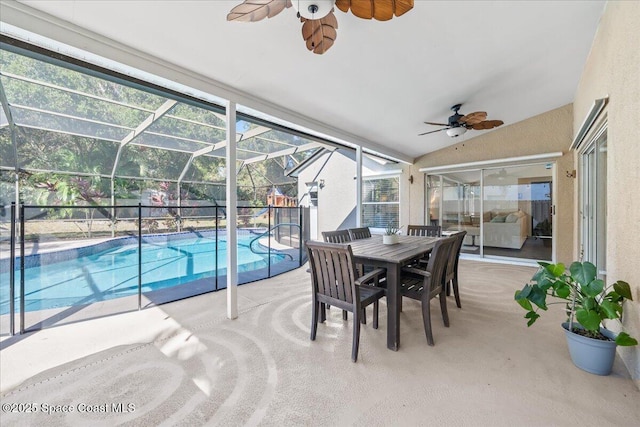 sunroom / solarium with a pool, ceiling fan, and lofted ceiling