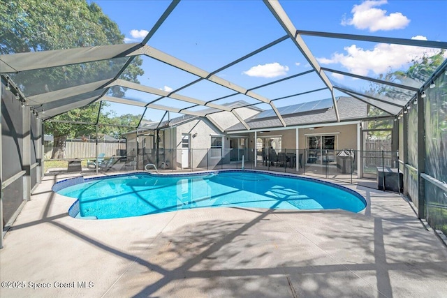 view of swimming pool with a lanai and a patio area