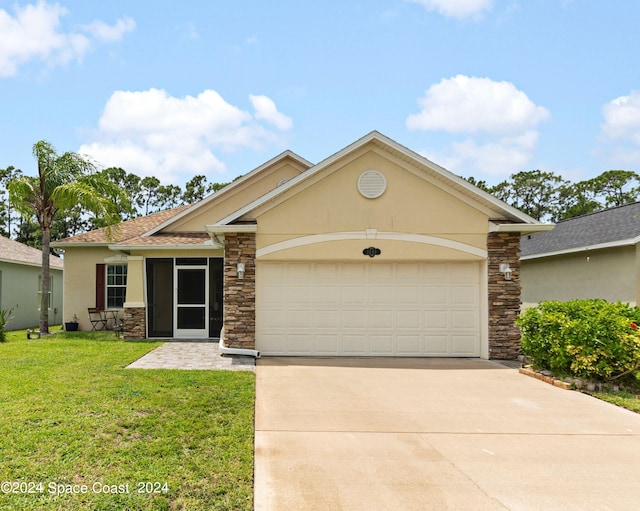 ranch-style home featuring a garage and a front yard