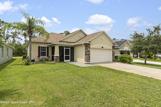 view of front of house featuring a garage and a front yard