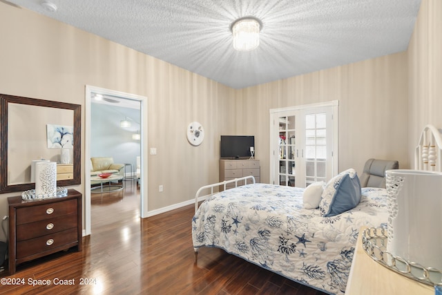 bedroom featuring wood-type flooring and a textured ceiling