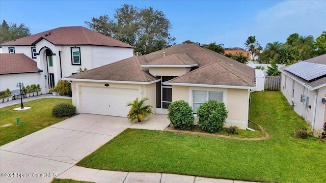 view of front facade featuring a garage and a front lawn