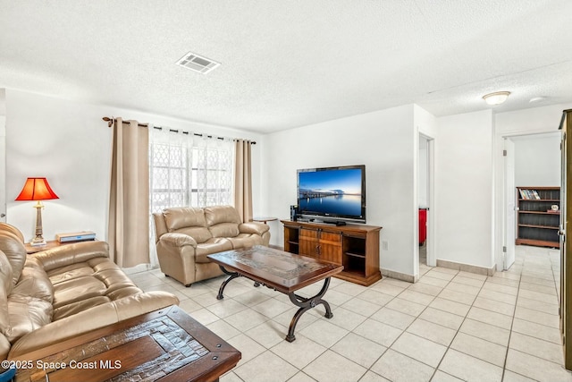 tiled living room with a textured ceiling