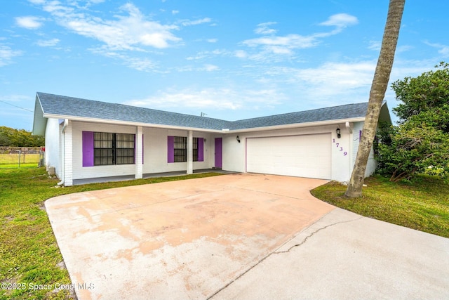 ranch-style home with a front lawn and a garage