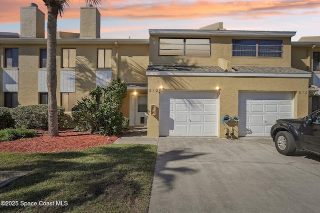 townhome / multi-family property featuring a garage