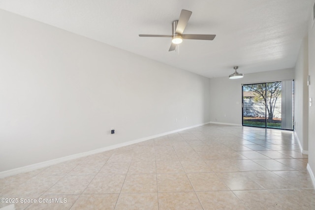 tiled empty room with ceiling fan