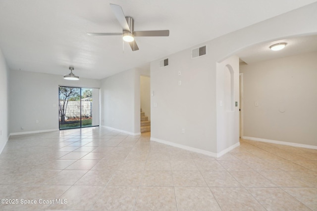 unfurnished room featuring light tile patterned flooring and ceiling fan