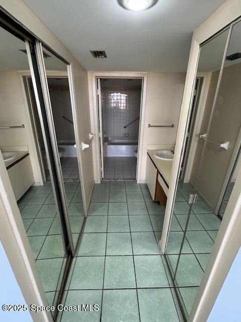 bathroom with vanity and tile patterned floors