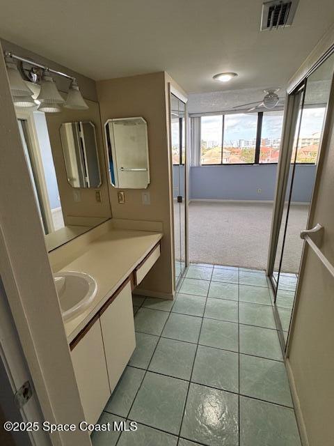 bathroom featuring tile patterned floors and vanity