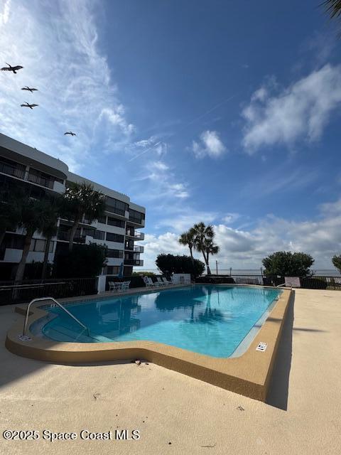 view of swimming pool featuring a patio