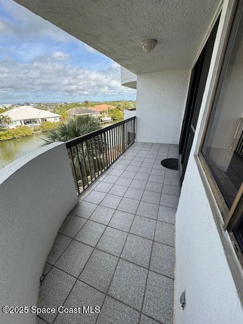 balcony featuring a water view