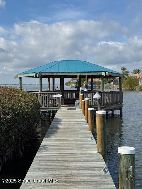 dock area featuring a gazebo and a water view