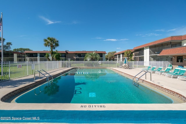 view of swimming pool featuring a patio area