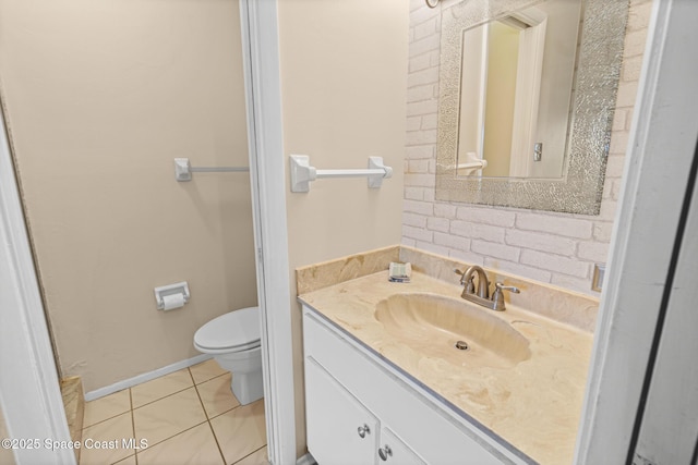 bathroom featuring toilet, vanity, and tile patterned floors