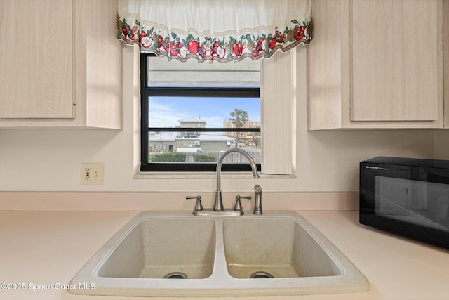 kitchen featuring sink and light brown cabinets