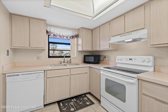 kitchen with light tile patterned floors, sink, light brown cabinets, and white appliances