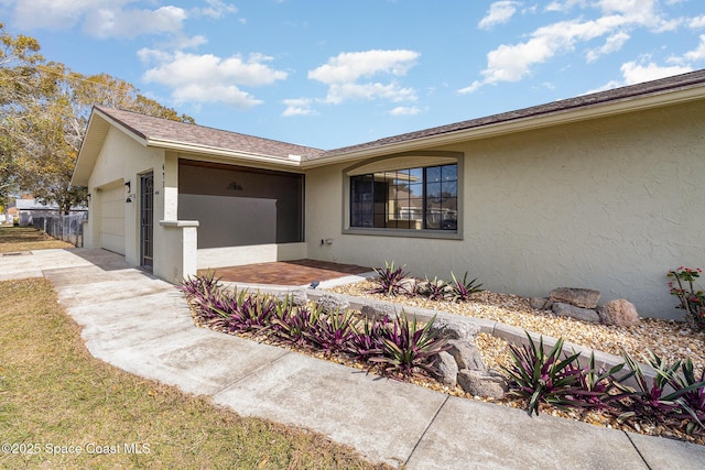 view of front of property featuring a garage