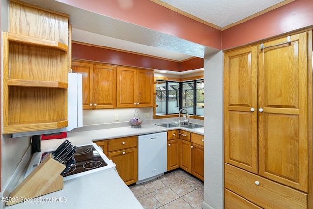 kitchen featuring light tile patterned floors, sink, and white appliances