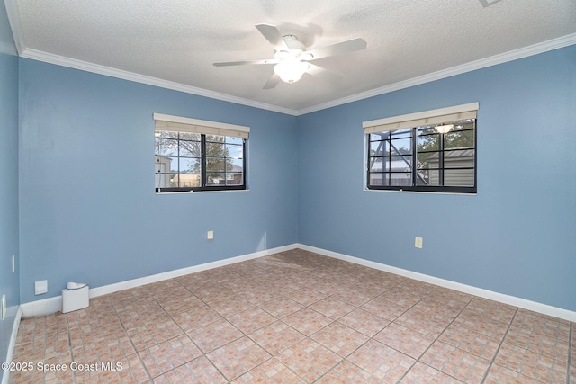 empty room featuring ceiling fan, plenty of natural light, a textured ceiling, and ornamental molding