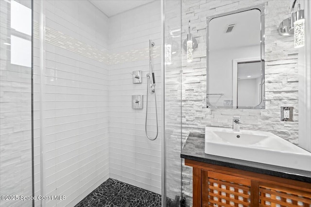 bathroom with vanity and walk in shower