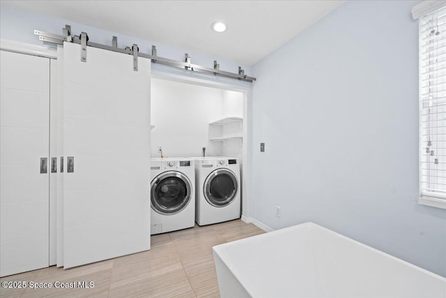 washroom featuring light tile patterned floors and separate washer and dryer