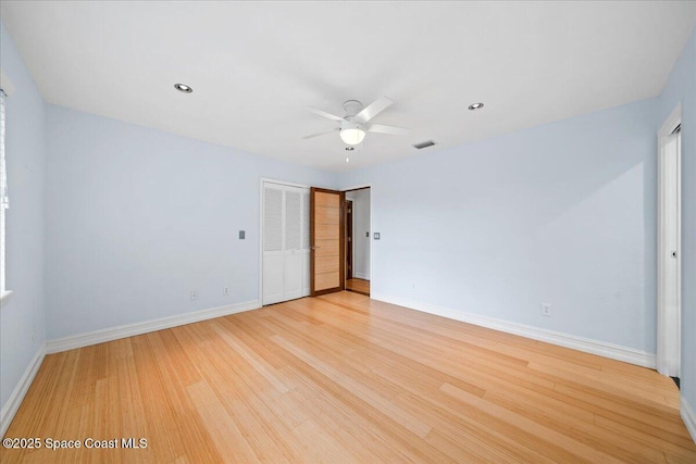 unfurnished room featuring ceiling fan and light hardwood / wood-style floors