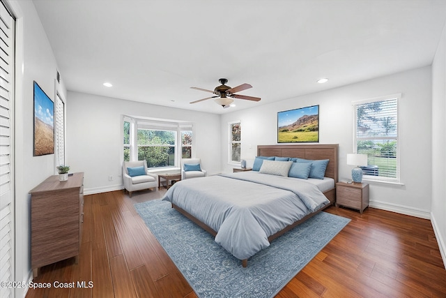 bedroom featuring dark hardwood / wood-style floors and ceiling fan