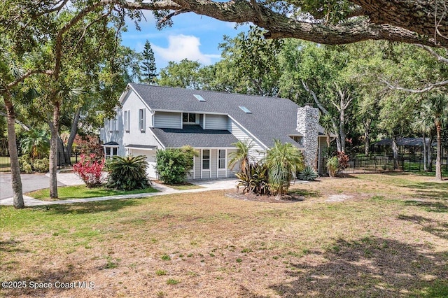 145 Crispin St, Merritt Island, FL 32952 - view of front of house with a chimney, roof with shingles, and a garage